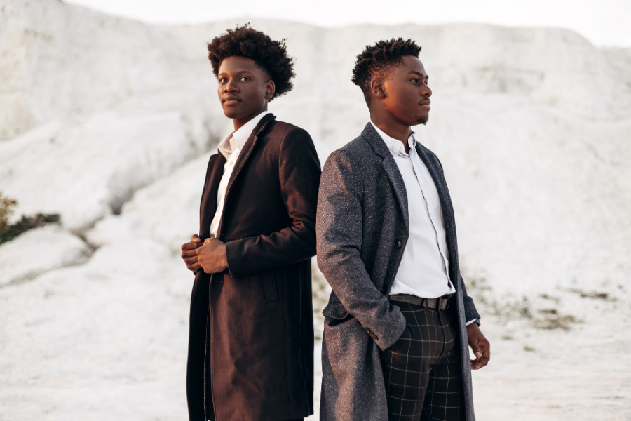 Two men are posing in stylish dress Two men are posing in stylish dress