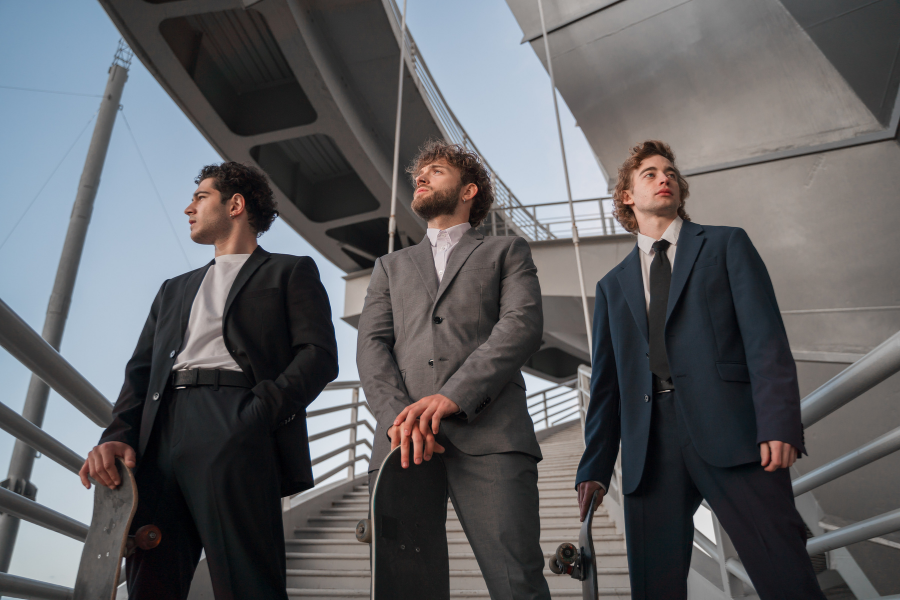 Three People Are Standing On The Stairs
