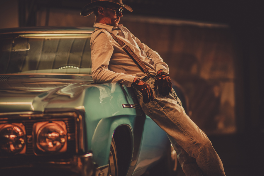 A man leaning on a car A man leaning on a car