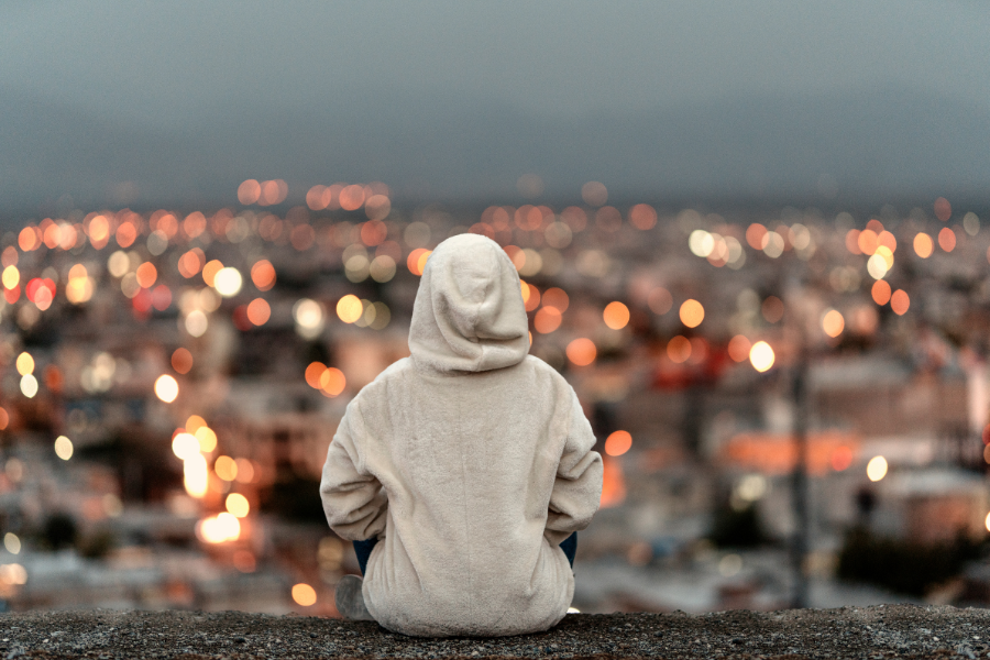 A girl sitting on a higher place A girl sitting on a higher place