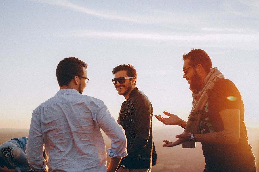Three men are laughing together Three men are laughing together