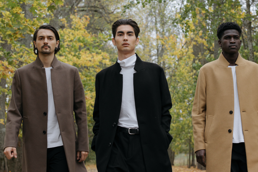 Three men are wearing stylish dresses Three men are wearing stylish dresses