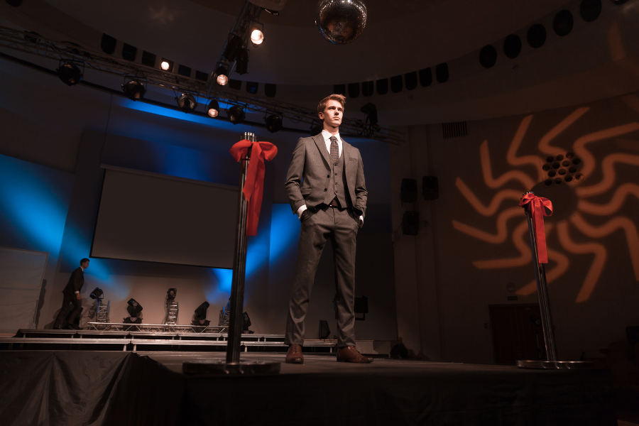 A man standing on a stage A man standing on a stage